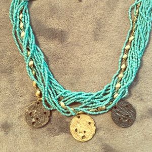 Beaded necklace with gold charms